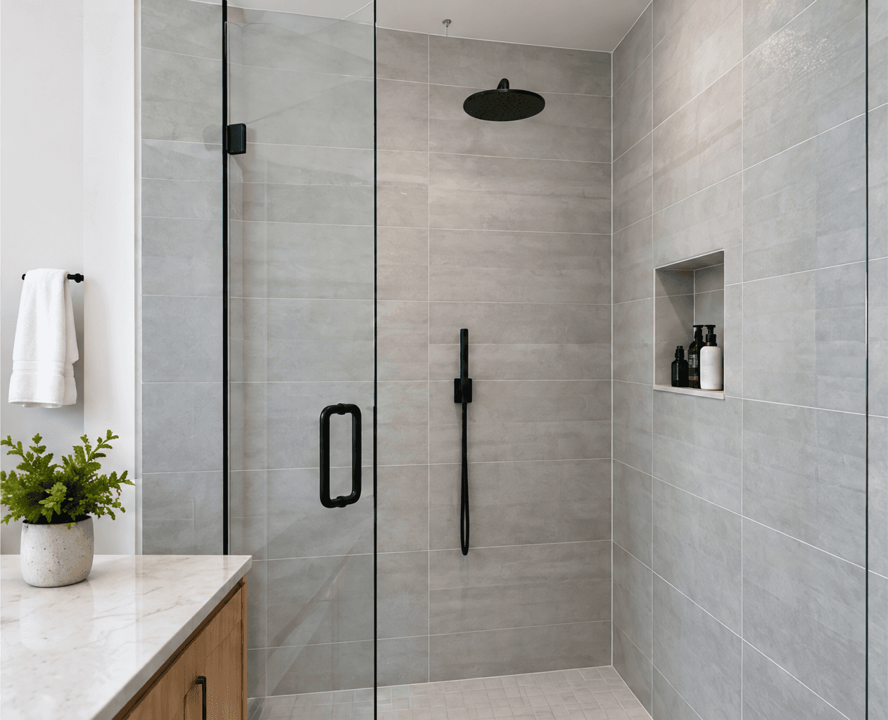 Finished bathroom with a glass shower and black fixtures